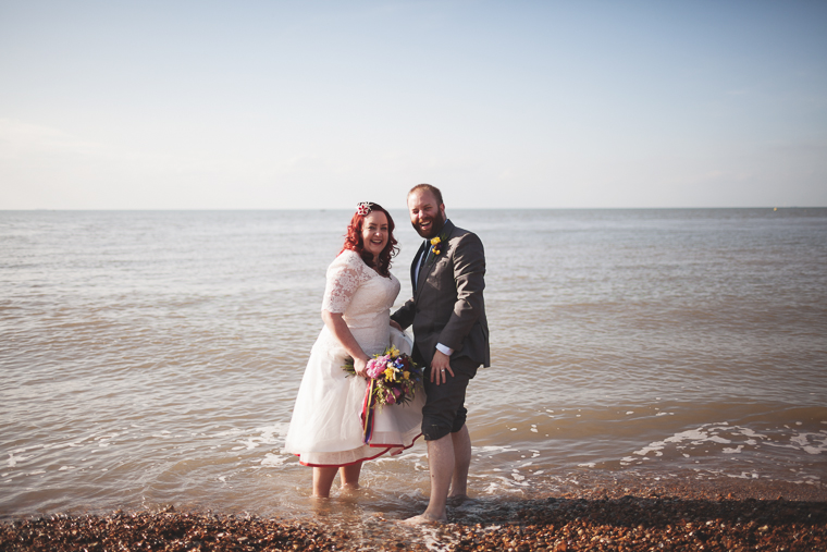 Wedding couple paddling in the sea at Whitstable, Kent, Lobster Shack East Quay